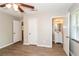 Bedroom with hardwood floors, private bath access, and ceiling fan at 3141 Bellgreen Way, Decatur, GA 30032