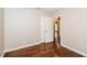 Simple bedroom with hardwood floors and access to another room at 3141 Bellgreen Way, Decatur, GA 30032