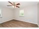 Bright bedroom featuring hardwood floors and ceiling fan at 3141 Bellgreen Way, Decatur, GA 30032