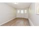 Spacious bedroom with hardwood floors and neutral walls at 3141 Bellgreen Way, Decatur, GA 30032