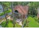 Aerial shot of a backyard with an outdoor kitchen, brick patio, and green lawn at 1290 Pasadena Ne Ave, Atlanta, GA 30306