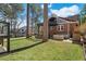 Spacious backyard with a brick patio and outdoor kitchen under a dark pergola at 1290 Pasadena Ne Ave, Atlanta, GA 30306