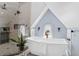 Modern bathroom featuring a soaking tub below a window and a glass-enclosed shower at 1290 Pasadena Ne Ave, Atlanta, GA 30306