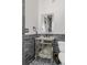 Chic bathroom featuring mirrored vanity, stylish fixtures, and gray tile accent wall at 1290 Pasadena Ne Ave, Atlanta, GA 30306
