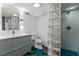 Updated bathroom featuring sleek vanity, glass block shower, and modern fixtures at 1290 Pasadena Ne Ave, Atlanta, GA 30306