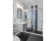 Stunning bathroom with glass enclosed shower, mosaic tile floor, and stylish vanity at 1290 Pasadena Ne Ave, Atlanta, GA 30306