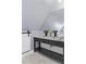 Bathroom vanity with black hardware, marble counter, and sliding barn door at 1290 Pasadena Ne Ave, Atlanta, GA 30306