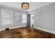 Spacious bedroom features hardwood floors, a modern chandelier, and ample natural light at 1290 Pasadena Ne Ave, Atlanta, GA 30306