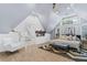 Bright bedroom boasts a fireplace, dormer windows, and an ensuite bathroom with a soaking tub at 1290 Pasadena Ne Ave, Atlanta, GA 30306
