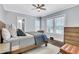 Bedroom with natural light, wood floors, a ceiling fan, and neutral decor at 1290 Pasadena Ne Ave, Atlanta, GA 30306
