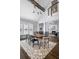 Dining room with vaulted ceiling, modern chandelier, and hardwood floors at 1290 Pasadena Ne Ave, Atlanta, GA 30306