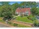 Charming brick Tudor home featuring a manicured lawn and red tile roof at 1290 Pasadena Ne Ave, Atlanta, GA 30306