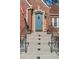 Charming front door with brick accents, an ornate railing, and beautiful landscaping at 1290 Pasadena Ne Ave, Atlanta, GA 30306
