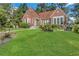Charming brick home with a manicured lawn and beautiful landscaping at 1290 Pasadena Ne Ave, Atlanta, GA 30306
