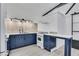 Modern kitchen with blue cabinets, stainless steel appliances, and sleek countertops at 1290 Pasadena Ne Ave, Atlanta, GA 30306
