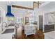 Open concept kitchen with a large island, modern appliances, and hardwood floors at 1290 Pasadena Ne Ave, Atlanta, GA 30306
