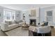Bright living room with a fireplace, bay window, and comfortable seating at 1290 Pasadena Ne Ave, Atlanta, GA 30306