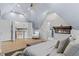 Brightly-lit main bedroom with modern fireplace and an open view to second story at 1290 Pasadena Ne Ave, Atlanta, GA 30306