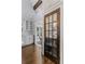 Walk-in pantry features custom door and designer wine storage at 1290 Pasadena Ne Ave, Atlanta, GA 30306