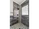 Elegant shower with unique tilework, decorative accents, and contemporary fixtures at 1290 Pasadena Ne Ave, Atlanta, GA 30306