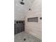 Close-up of modern shower with dual shower heads and decorative tile niche at 1290 Pasadena Ne Ave, Atlanta, GA 30306