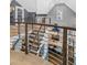 Open staircase with metal railings leading to the kitchen with eat-in island at 1290 Pasadena Ne Ave, Atlanta, GA 30306