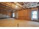 Unfinished basement with exposed framing and a door at 161 Parkview Place Dr, Mcdonough, GA 30253