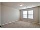 Simple bedroom with carpet and two windows at 161 Parkview Place Dr, Mcdonough, GA 30253
