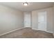 Spacious bedroom with neutral walls and carpet at 161 Parkview Place Dr, Mcdonough, GA 30253