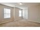 Bright bedroom featuring two windows and neutral decor at 161 Parkview Place Dr, Mcdonough, GA 30253