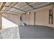 Attached garage with an open garage door and epoxy floor at 161 Parkview Place Dr, Mcdonough, GA 30253