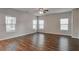 Spacious living room with hardwood floors and lots of natural light at 161 Parkview Place Dr, Mcdonough, GA 30253