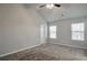 Main bedroom with vaulted ceiling, carpet, and two windows at 161 Parkview Place Dr, Mcdonough, GA 30253