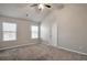 Main bedroom with vaulted ceiling, carpet, and two windows at 161 Parkview Place Dr, Mcdonough, GA 30253