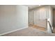 Upstairs hallway with carpet, built-in storage, and access to other rooms at 161 Parkview Place Dr, Mcdonough, GA 30253
