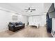 Basement with a fold-out bed, leather couch, and large TV at 275 Trowbridge Ln, Lawrenceville, GA 30043