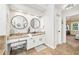 Double vanity bathroom with granite countertop and large mirrors at 275 Trowbridge Ln, Lawrenceville, GA 30043