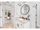 Bathroom with granite vanity, large mirror, and view of bedroom at 275 Trowbridge Ln, Lawrenceville, GA 30043