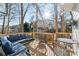Relaxing deck with seating and fire pit, overlooking wooded area at 275 Trowbridge Ln, Lawrenceville, GA 30043