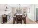 Formal dining room with a large table, buffet, and neutral decor at 275 Trowbridge Ln, Lawrenceville, GA 30043