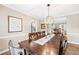 Bright dining room with a wooden table and chandelier at 275 Trowbridge Ln, Lawrenceville, GA 30043
