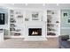 Fireplace with built-in shelving on either side at 275 Trowbridge Ln, Lawrenceville, GA 30043
