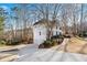 White two-story house with attached two-car garage at 275 Trowbridge Ln, Lawrenceville, GA 30043