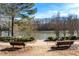 Serene lakefront view with benches at 275 Trowbridge Ln, Lawrenceville, GA 30043