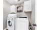 Laundry room with washer, dryer, and cabinets at 275 Trowbridge Ln, Lawrenceville, GA 30043