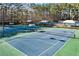 Community tennis courts with shade structures at 275 Trowbridge Ln, Lawrenceville, GA 30043