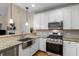 Modern kitchen with stainless steel appliances and granite countertops at 2889 Lavista Rd # 8, Decatur, GA 30033