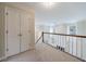 Open upper hallway overlooking the great room below at 228 Spalding Gates Dr, Atlanta, GA 30328