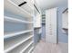 Spacious walk-in closet with ample shelving and hanging rods at 228 Spalding Gates Dr, Atlanta, GA 30328