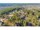 Aerial view of homes nestled in a wooded area at 3110 Haverhill Ne Cv, Conyers, GA 30012